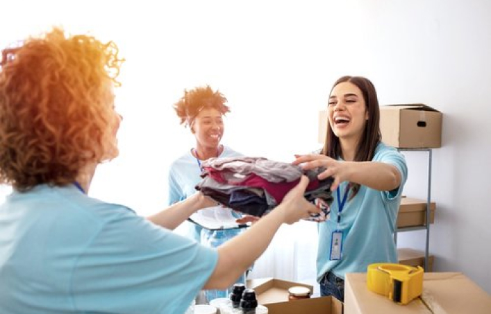 Volunteers handing out clothes