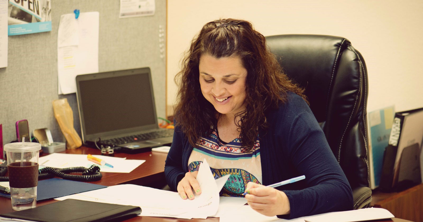 An Opening Doors employee working at her desk