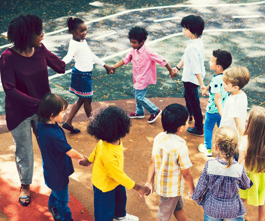 A group of children playing together in circle