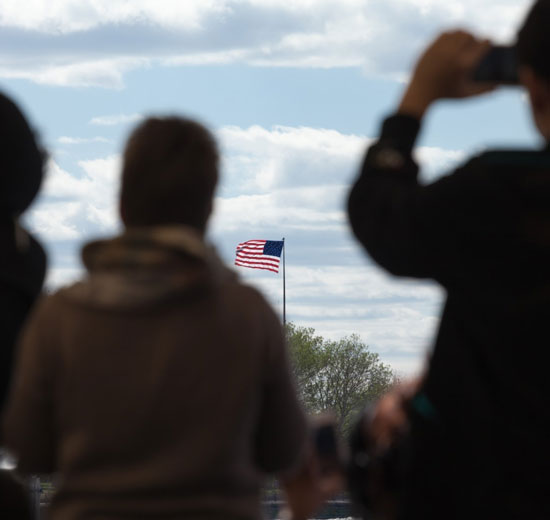 The American flag as seen through a crowd