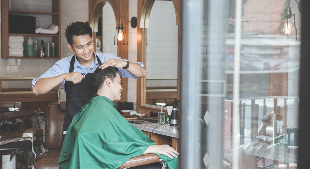 An immigrant working as a barber